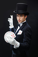 Image showing magician showing trick with playing cards