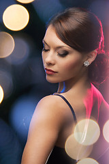 Image showing woman in evening dress wearing diamond earrings