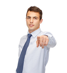 Image showing friendly young buisnessman pointing finger