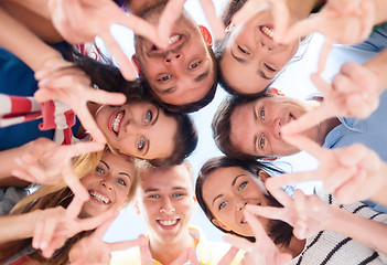 Image showing group of teenagers showing finger five gesture