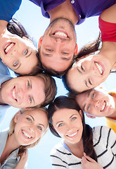 Image showing group of teenagers looking down