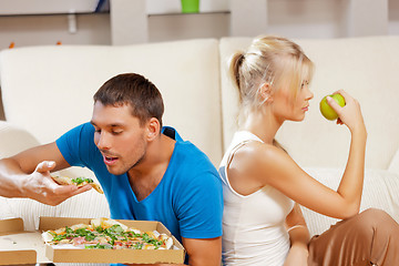 Image showing couple eating different food