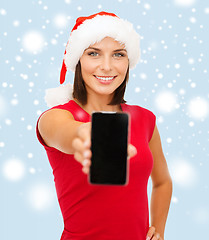 Image showing woman in santa helper hat with smartphone