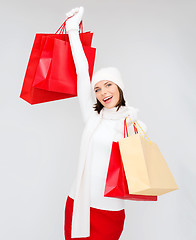 Image showing picture of happy woman with shopping bags