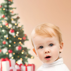 Image showing happy little boy with christmas tree and gifts