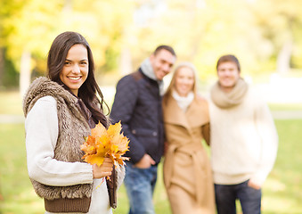 Image showing group of friends having fun in autumn park