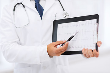 Image showing male doctor hands holding cardiogram