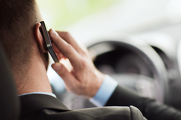 Image showing man using phone while driving the car