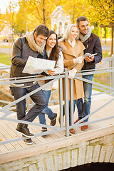 Image showing couples with tourist map in autumn park