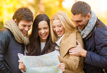 Image showing couples with tourist map in autumn park