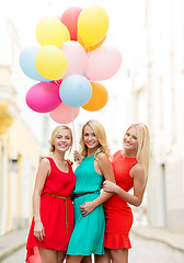 Image showing beautiful girls with colorful balloons in the city
