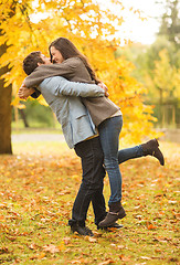 Image showing romantic couple playing in the autumn park