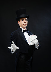 Image showing magician showing trick with playing cards