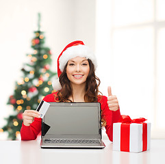 Image showing woman with gift, laptop computer and credit card