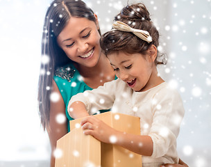 Image showing happy mother and child girl with gift box