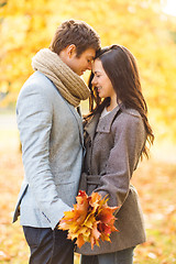 Image showing romantic couple kissing in the autumn park