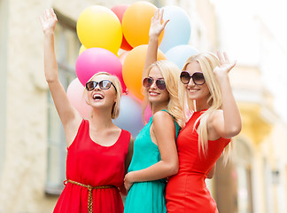 Image showing beautiful girls with colorful balloons in the city