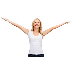 Image showing woman with raised hands in blank white t-shirt