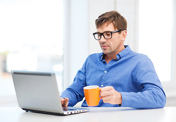 Image showing man working with laptop at home