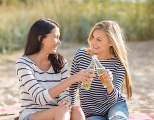 Image showing girls with drinks on the beach