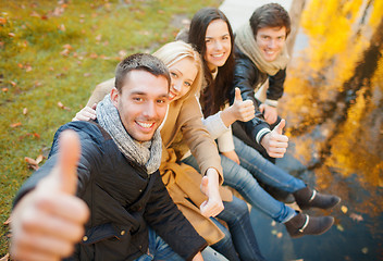 Image showing group of friends having fun in autumn park