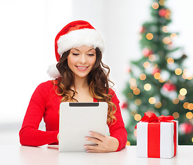 Image showing woman with gift box and tablet pc computer