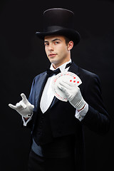 Image showing magician showing trick with playing cards