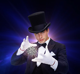 Image showing magician in top hat showing trick