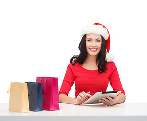 Image showing woman with gift box and tablet pc computer