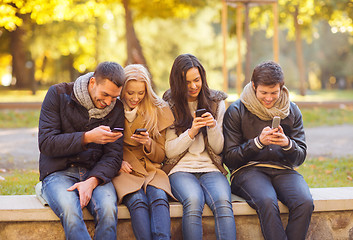 Image showing group of friends having fun in autumn park