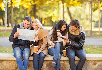 Image showing couples with tourist map in autumn park