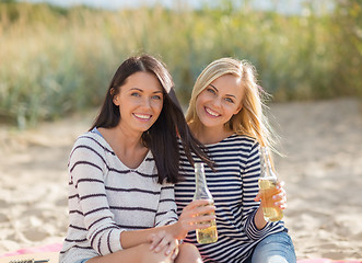 Image showing girls with drinks on the beach