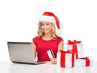 Image showing woman with gifts, laptop computer and credit card