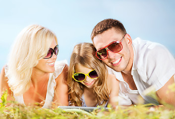 Image showing happy family with tablet pc