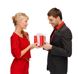 Image showing smiling woman and man with gift box