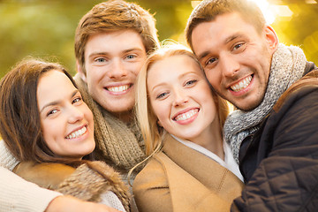 Image showing group of friends having fun in autumn park