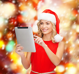 Image showing woman in santa helper hat with tablet pc