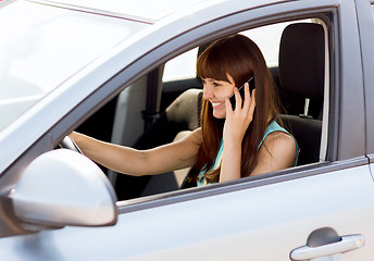 Image showing woman using phone while driving the car