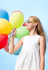 Image showing happy girl with colorful balloons