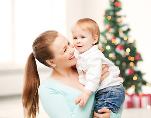 Image showing happy mother with adorable baby