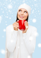 Image showing woman in hat with red tea or coffee mug