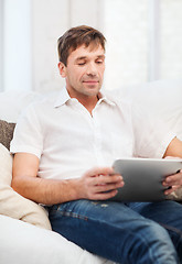 Image showing man working with tablet pc at home