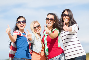 Image showing teenage girls or young women showing thumbs up