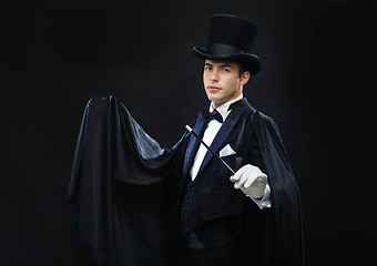 Image showing magician in top hat with magic wand showing trick