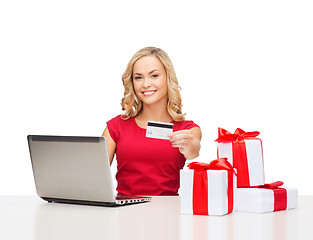 Image showing woman with gifts, laptop computer and credit card