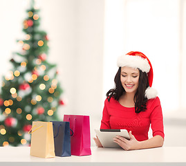 Image showing woman with gift box and tablet pc computer