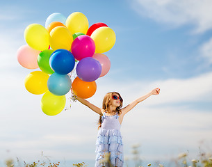 Image showing happy girl with colorful balloons