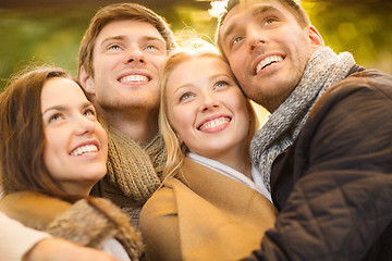 Image showing group of friends having fun in autumn park