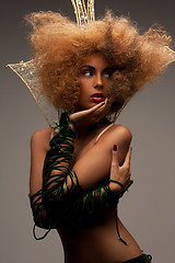 Image showing woman with long curly hair in crown