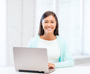 Image showing international student girl with laptop at school